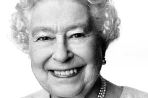 a black and white photo of the queen, smiling, aged 88